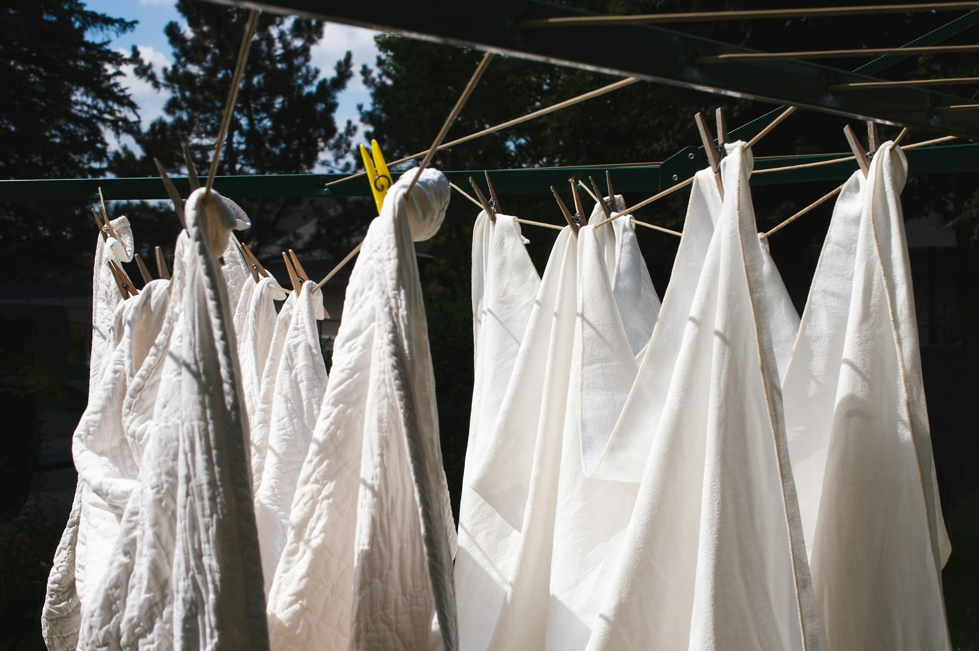 White cotton laundry drying on a line